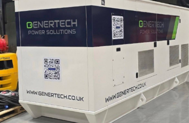 a white and black genertech generator that has QR codes on the back and on the side. The URL of Genertech is on the bottom of both sides and so is the Genertech Logo.