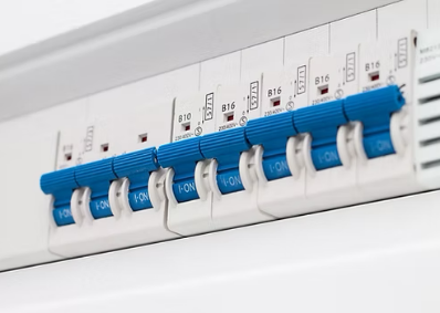 A consumer level miniature circuit breaker that's white with blue switches which control power flow.