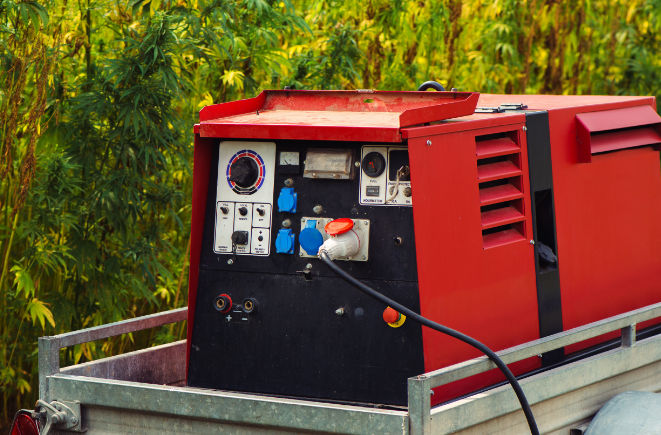 a stock image of a red heavy duty generator that's made for powering welding equipment.